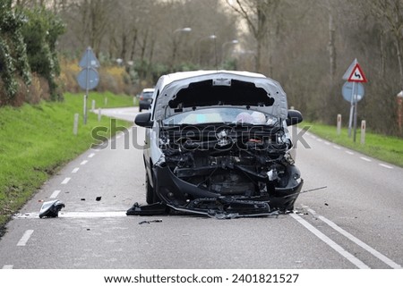 Wreck of a car after a hard collision in Nieuwerkerk aan den IJssel in the Netherlands Royalty-Free Stock Photo #2401821527