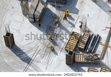 Aerial Top Down View on a Constructions Site with Team of Worker. High quality photo