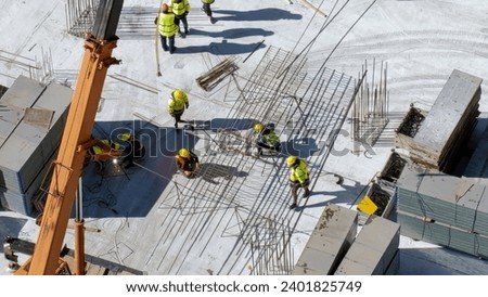 Aerial Top Down View on a Constructions Site with Team of Worker. High quality photo