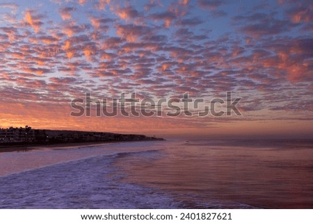 Beautiful sunrise on the ocean beach. Good for wallpaper or background for text.