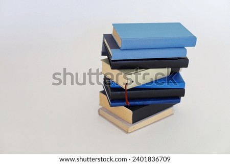 Blue and black books on white