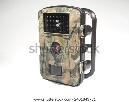 Hunting trail camera on a white background. Photo and video trap. Animal monitoring device with motion sensor