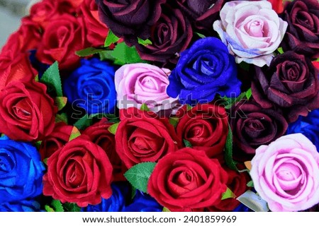 Red blue pinkburgundy coloured artificial roses for Valentine's Day