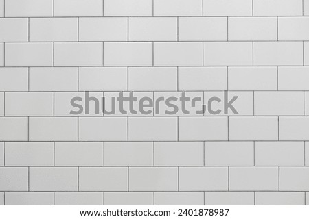 Seamless Subway Tile Texture Background in Pristine White, Perfect for Modern Kitchen Backsplash and Bathroom Wall Designs Royalty-Free Stock Photo #2401878987