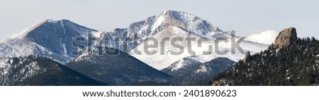 Panoramic view of Rocky Mountain National Parks highest mountains viewed from Estes Park Colorado in mid-Winter. 
