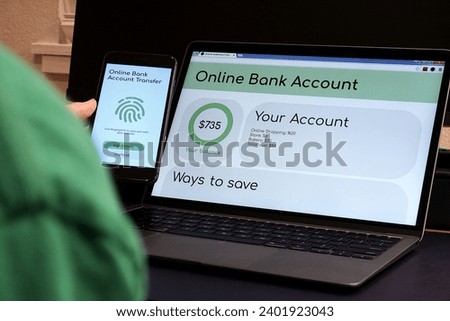 Picture of someone using an online banking service through technology. "SHOTLISTbanking"