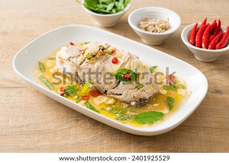 steamed sea bass fish fillet steak with herbs Royalty-Free Stock Photo #2401925529