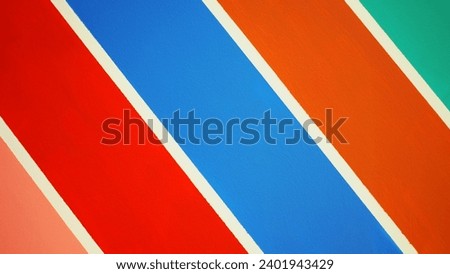 Abstract of the geometric of orange, red, blue and green texture Background shotten from wall. Picture for use in illustrations Background image or copy space.