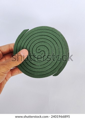 Mosquito repellent is round, green on a white background