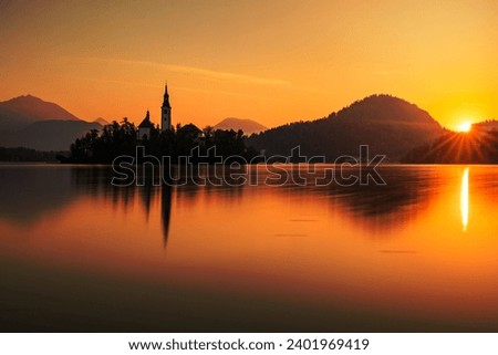 Autumn view on Bled Lake with Pilgrimage Church of the Assumption of Maria, Bled, Slovenia, Europe Royalty-Free Stock Photo #2401969419