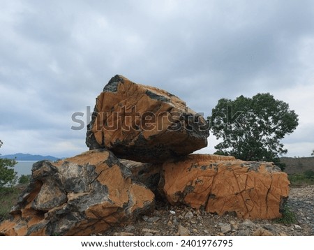 Big Rocks and the lake at Bukit Batu Riam Kanan, Banjar, South Kalimantan, Indonesia Royalty-Free Stock Photo #2401976795