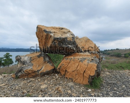 Big Rocks and the lake at Bukit Batu Riam Kanan, Banjar, South Kalimantan, Indonesia Royalty-Free Stock Photo #2401977773