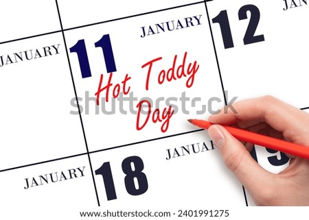 January 11. Hand writing text Hot Toddy Day on calendar date. Save the date. Holiday.  Day of the year concept. Royalty-Free Stock Photo #2401991275