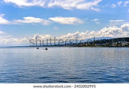 Campbell River, British Columbia, Canada as viewed from the ocean Royalty-Free Stock Photo #2402002995
