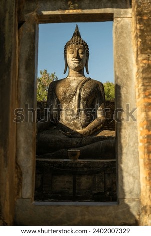 The huge sitting Buddha in Wat Si Chum at Sukhothai, Thailand. 