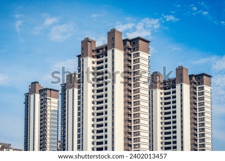 Beautiful modern high-rise residential building Royalty-Free Stock Photo #2402013457