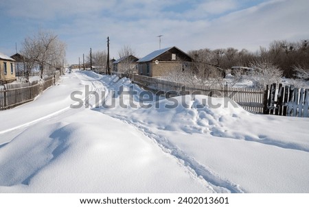 Village street Znamensky village Ivanteevsky district, Saratov region Sunny winter day Royalty-Free Stock Photo #2402013601