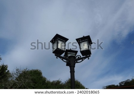 Photo of garden lights with a blue sky background. This photo is suitable for websites and also for architectural and landscape catalogs. Architectural photography