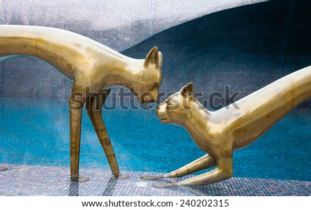 cat brass sculpture Royalty-Free Stock Photo #240202315
