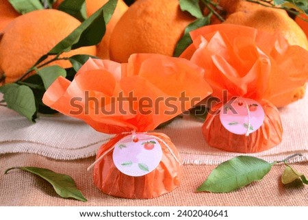 Small guest gifts oranges sweets cookies beautiful packaging christmas favors decoration in orange color, original party presents, handmade diy homemade concept ideas