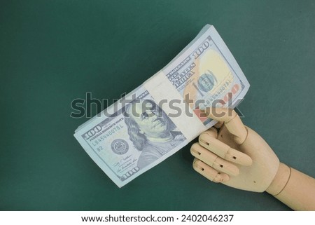 hand holding 100 dollar bill. the concept of income or salary. Dollar cash. investment, money exchange, bribes or corruption.