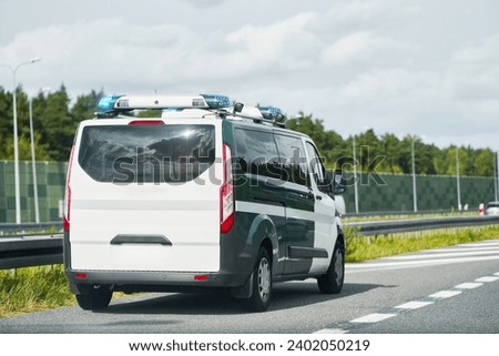 Traffic control van on the highway. Mobile radar speed safety camera unit parked at the side of a road checking traffic speed. Surveillance and preventive control on the interstate roads. Copy space