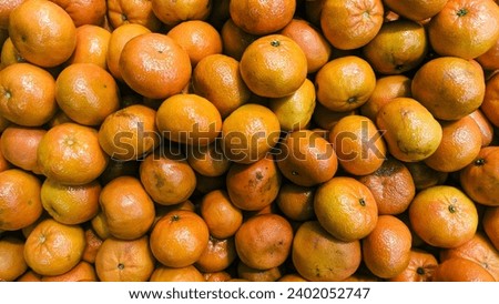 Close-up of Medan Oranges in a fruit shop display, photographed from above. Local oranges typical of the Medan region of Indonesia, fruit full of vitamin C.
