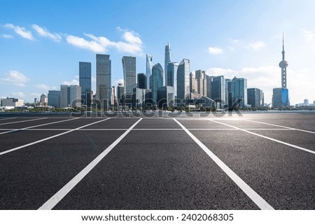 parking lot with city skyline