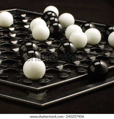 Abalone game white and black marble balls