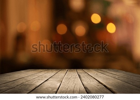 Empty beautiful wooden tabletop and blurred bokeh modern cafe interior background in clean and bright, banner ready for product installation