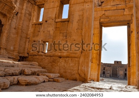 The Bel Temple in Palmyra, Syria, is an ancient architectural marvel. Majestic columns and intricate carvings adorn its facade, reflecting a blend of Roman and Semitic influences. The temple, dedicate Royalty-Free Stock Photo #2402084953