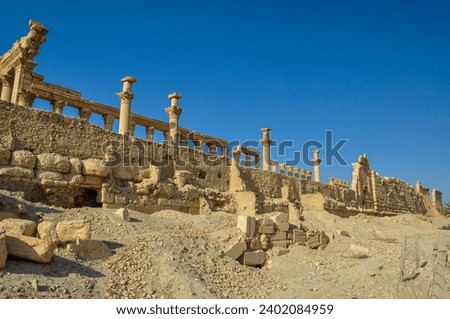 The Bel Temple in Palmyra, Syria, is an ancient architectural marvel. Majestic columns and intricate carvings adorn its facade, reflecting a blend of Roman and Semitic influences. The temple, dedicate Royalty-Free Stock Photo #2402084959