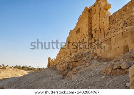 The Bel Temple in Palmyra, Syria, is an ancient architectural marvel. Majestic columns and intricate carvings adorn its facade, reflecting a blend of Roman and Semitic influences. The temple, dedicate Royalty-Free Stock Photo #2402084967