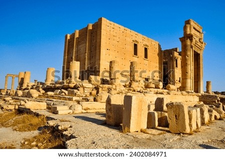 The Bel Temple in Palmyra, Syria, is an ancient architectural marvel. Majestic columns and intricate carvings adorn its facade, reflecting a blend of Roman and Semitic influences. The temple, dedicate Royalty-Free Stock Photo #2402084971