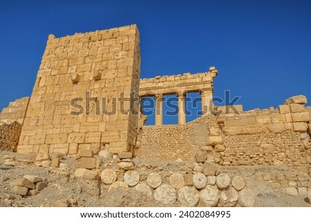 The Bel Temple in Palmyra, Syria, is an ancient architectural marvel. Majestic columns and intricate carvings adorn its facade, reflecting a blend of Roman and Semitic influences. The temple, dedicate Royalty-Free Stock Photo #2402084995