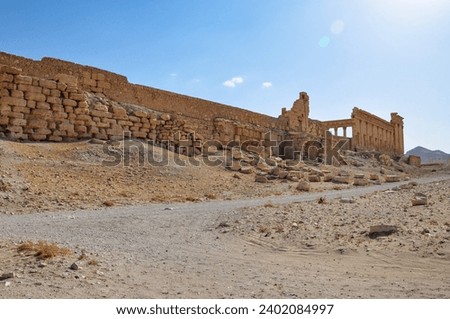 The Bel Temple in Palmyra, Syria, is an ancient architectural marvel. Majestic columns and intricate carvings adorn its facade, reflecting a blend of Roman and Semitic influences. The temple, dedicate Royalty-Free Stock Photo #2402084997