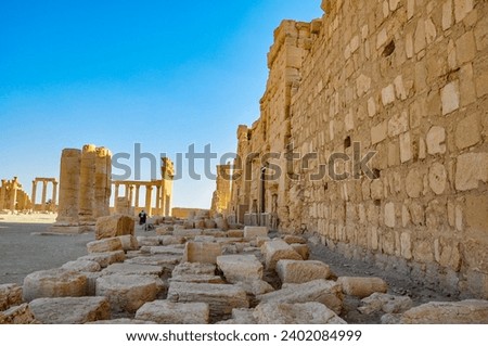 The Bel Temple in Palmyra, Syria, is an ancient architectural marvel. Majestic columns and intricate carvings adorn its facade, reflecting a blend of Roman and Semitic influences. The temple, dedicate Royalty-Free Stock Photo #2402084999