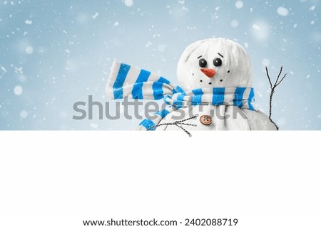 cute snowman waving his hand on a blue background, with white isolated copy space at the bottom