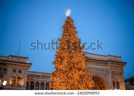 Milan, Italy 18.12.2023 in winter. Christmas tree in front of Milan cathedral, Duomo square in december, evening view. Christmas holidays in Milan. Christmas and New Year concept. High quality photo Royalty-Free Stock Photo #2402090093
