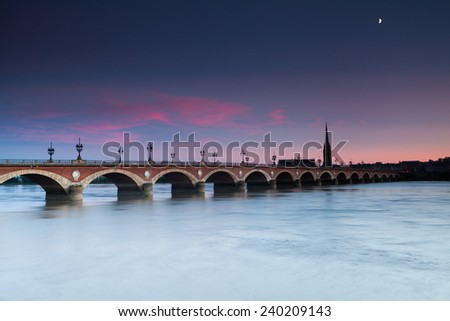 View of the Pont de pierre at sunset in the famous winery region Bordeaux, France