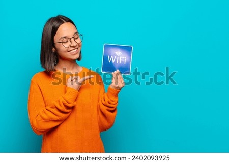 young latin pretty woman holding a placard with a concept 