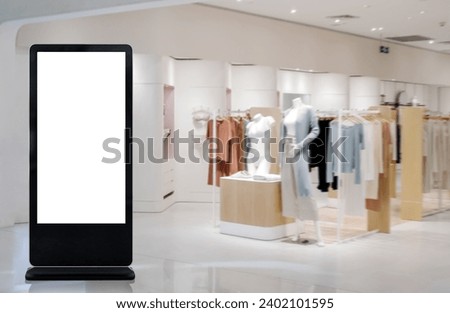 Modern empty totem, kiosk, signage in a shopping center shop. Blank space for adversting and message. Royalty-Free Stock Photo #2402101595