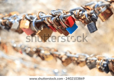 Makarska Croatia. Line of Love padlocks hanging on a chain. Love locks. Wedding locks. Symbol of eternal love. Valentine day. Colorful padlocks. Loyalty. Greeting card 