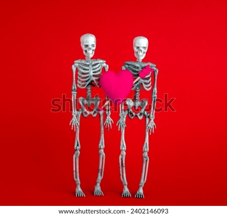Pair of skeletons with pink heart with an arrow on red background. Minimal art poster for Valentine's Day.