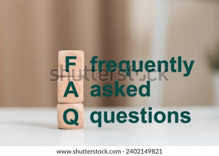 FAQ text (frequently asked questions), Text FAQ on wooden cube. Asking questions about various communication problems. Royalty-Free Stock Photo #2402149821