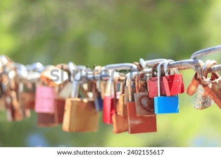 Makarska Croatia. Line of Love padlocks hanging on a chain. Love locks. Wedding locks. Symbol of eternal love. Colorful padlocks. Loyalty. Greeting card.  Valentine's Day. Couple. Clip art. Cards