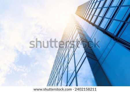 windows skyscraper business office blue sky corporate building city. architecture building exterior office building exterior city skyscraper cloud - sky glass - material built structure business offic Royalty-Free Stock Photo #2402158211