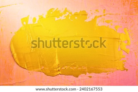 Gold element acrylic coating, painting plate-form like on pink matte canvas abstract texture background. Handmade, hand drawn. Center composition. Horizontal picture.