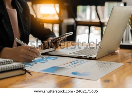 Accountant holding documents preparing performance analysis report Executives create documents at work using online computer software for analyzing financial data. Close-up pictures