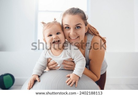An Exercising With Her Infant Son At Home, Happy Woman training with kid at home